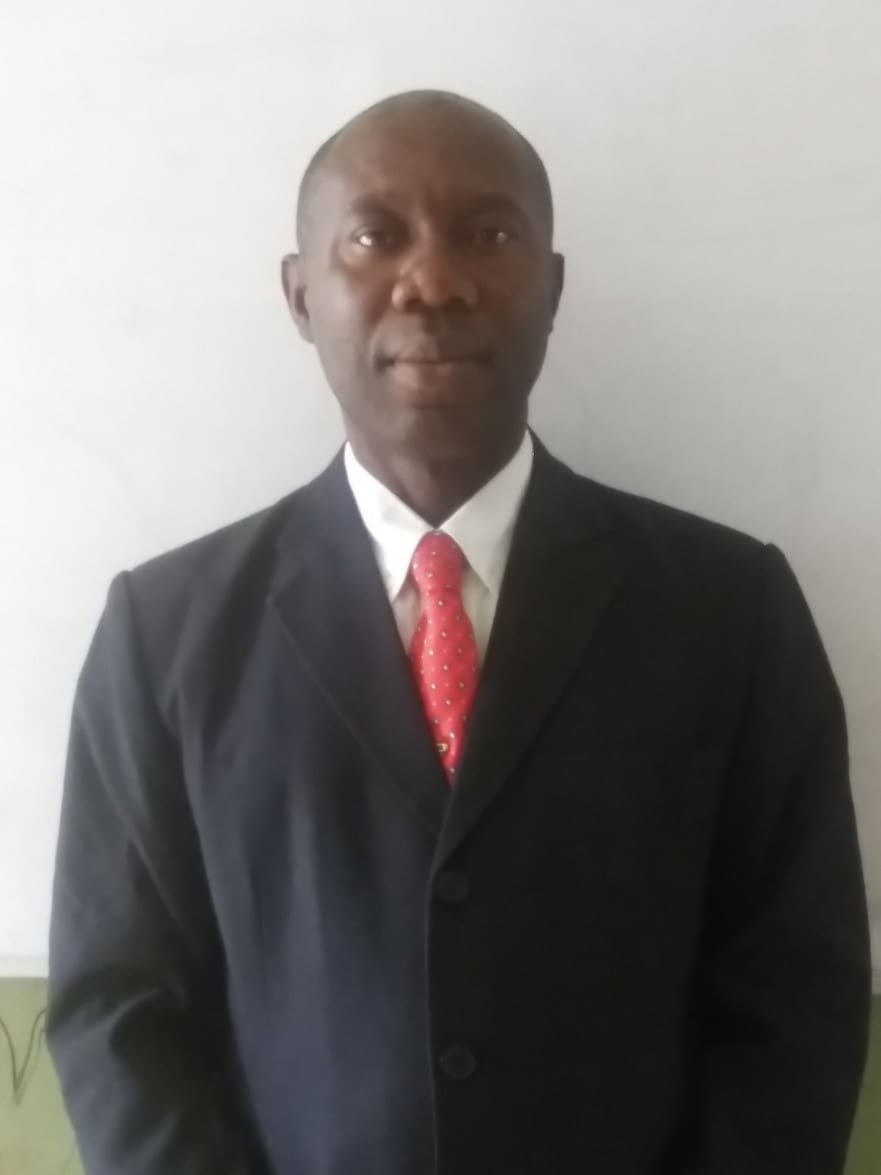 Professional man in suit at OAGS Africa event.